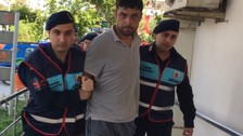 Bir aileyi öldürüp yaktığı iddia edilen şüpheli tutuklandı