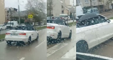 Milyonluk spor otomobilde bir garip görüntü! Arabanın üstünü kapatmak yerine şemsiye açtı