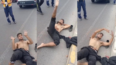 Düzce'de madde etkisindeki genç garip hareketler sergiledi! Yerlerde, polisin önünde oynadığı anlar kamerada