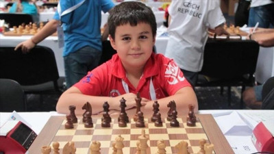 12 yaşındaki Yağız Kaan Erdoğmuş, "büyükusta" ünvanını aldı
