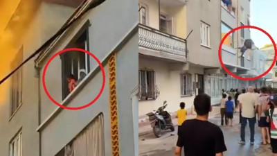 Evde çıkan yangında önce çocuğunu, sonra kendisini 3’üncü kattan attı; o anlar kamerada