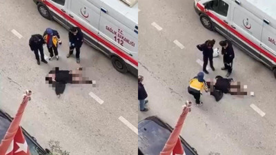 Yolun ortasında yatan kadın, sinir krizi geçirdi