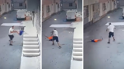 Kovaladığı çocuğu ayak bileğinden tutup yere fırlattı