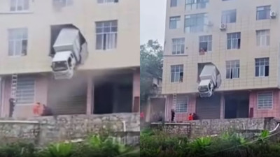 Çin’de binaya çarpan kamyon ikinci katta asılı kaldı