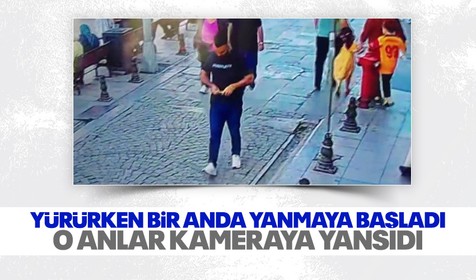 Yolda yürürken telefonu bir anda yanmaya başladı: O anlar kamerada