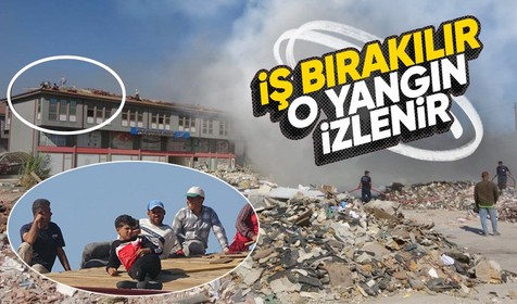 Enkaz alanında yangın çıktı: Çatıda çalışan işçiler rahatını bozmadan izledi!