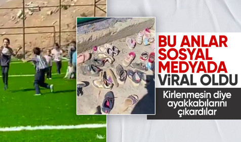 Van'da çocuklar yeni yapılan halı sahaya girerken ayakkabılarını çıkardı