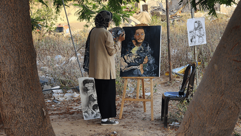 Filistinli ressam, sanatıyla Gazze'deki acı ve felaketi dünyaya duyurmaya çalışıyor - Resim : 1